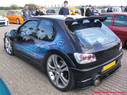 Lowriders that have been lowered, dropped, slammed, and scraping. Hugh chrome wheels.