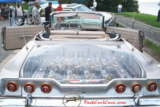 Lowriders that have been lowered, dropped, slammed, and scraping. Classic American Low rider, with see-thru trunk lid, and hood.