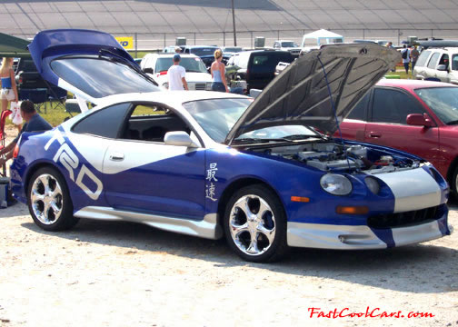 Lowriders that have been lowered, dropped, slammed, and scraping. 