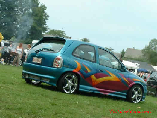 Lowriders that have been lowered, dropped, slammed, and scraping, using many different modifications.