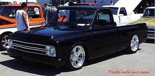 Lowrider pick-up that has been lowered, dropped, slammed, and scraping, using many different modifications.