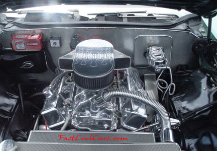 Lowriders that have been lowered, dropped, slammed, and scraping, using many different modifications. Cool engine compartment.