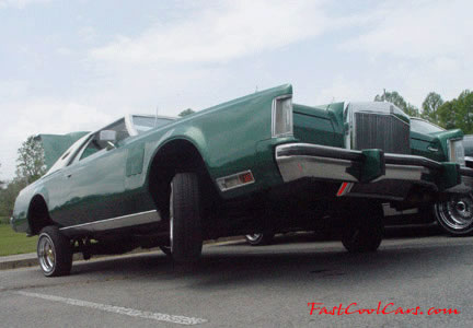 Lowriders that have been lowered, dropped, slammed, and scraping, using many different modifications.