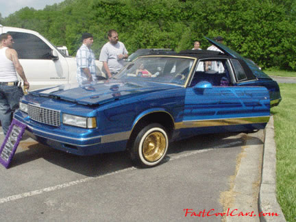 Lowriders that have been lowered, dropped, slammed, and scraping, using many different modifications.