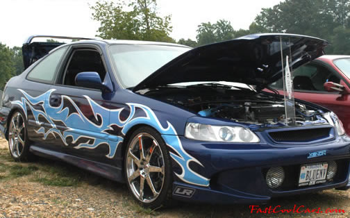 Lowriders that have been lowered, dropped, slammed, and scraping.