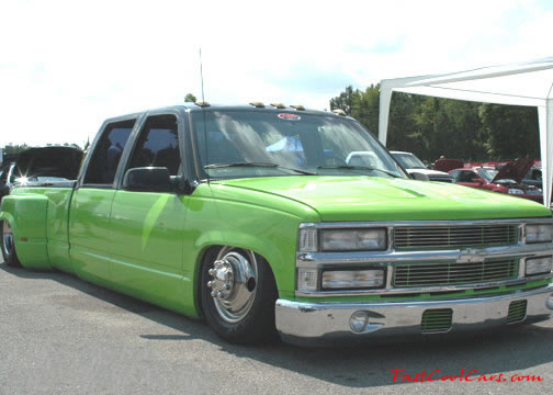 Lowriders that have been lowered, dropped, slammed, and scraping, using many different modifications. Slammed dually, on the ground.