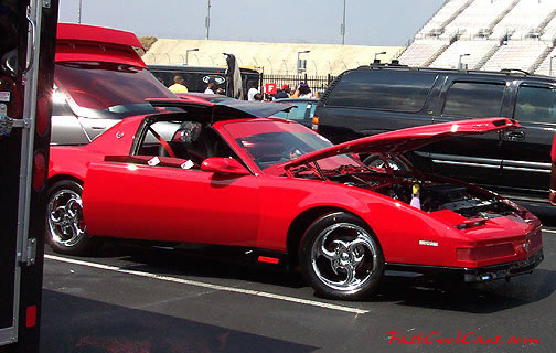 Lowriders that have been lowered, dropped, slammed, and scraping.