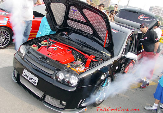 Lowriders that have been lowered, dropped, slammed, and scraping.