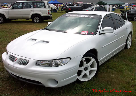 Lowriders that have been lowered, dropped, slammed, and scraping.