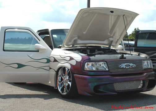 Lowriders that have been lowered, dropped, slammed, and scraping.
