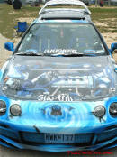 Lowriders that have been lowered, dropped, slammed, and scraping. see-thru hood, and custom graphics on paint.