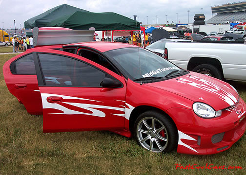 Lowriders that have been lowered, dropped, slammed, and scraping.