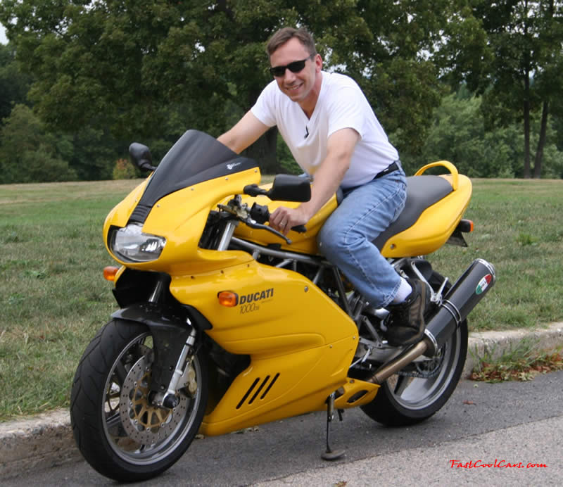 he Black one with #3 on the front is from Loudon New Hampshire's track. It is me on the bike. It's a Ducati 750ss with the plastics removed so they don't get scratched when I fall. Note: I do not own this bike. I rent it from Penguin racing strictly for racing at the track. The second picture is of my yellow 2003 Ducati ss1000ds. My everyday rider. It is basically the same bike as the track bike, but with a bigger fuel injected engine and full plastics. Yes that's me on the bike and I do own this one. Modified open air box, Ferracci carbon fiber pipes, carbon fiber: clutch cover, front fender and heel guards. It also has a Nuvi350 GPS mount on the windscreen. I am working on making a RE/MAX racing theme bike out of one of these bikes. Ted Duncan - Boston, MA.