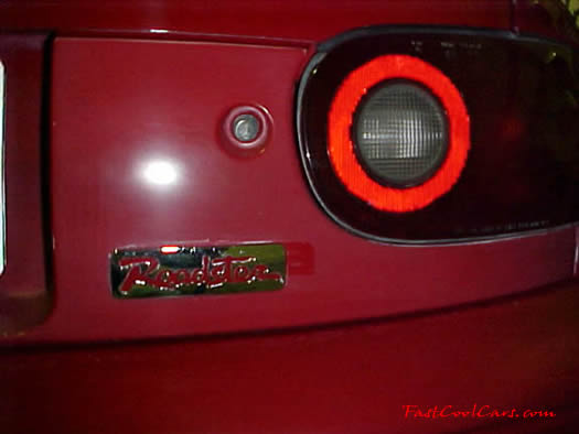 1990 Mazda Miata Roadster - rear 'roadster' badge view with the top down