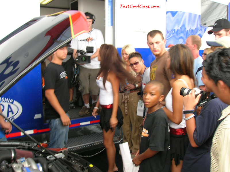 Nick Hogan talking with the models about pictures with his mom Linda Hogan standing near by.