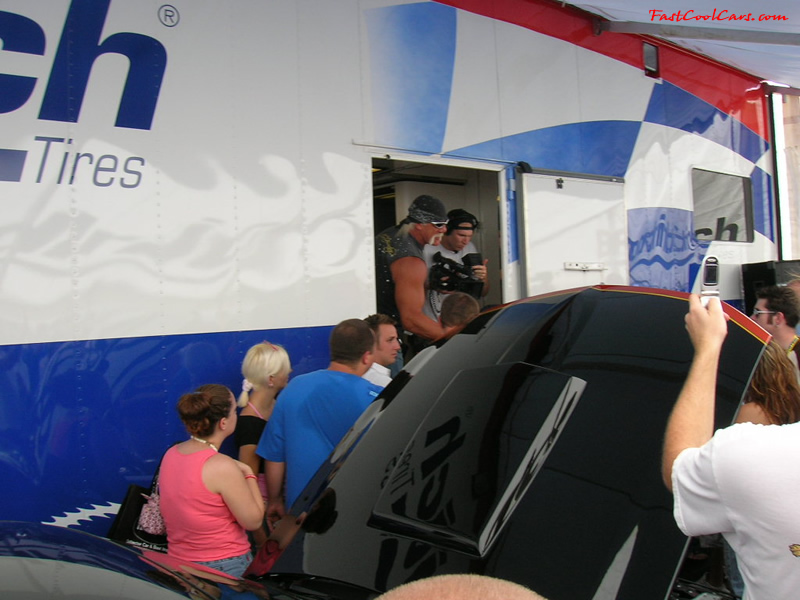Hulk Hogan looking out the Foose trailer to see if they are ready to make the announcements, and meet their fans and get pictures taken.