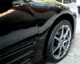 2003 Black Mitsubishi Eclipse Spyder convertible, with killer wheels, customized.